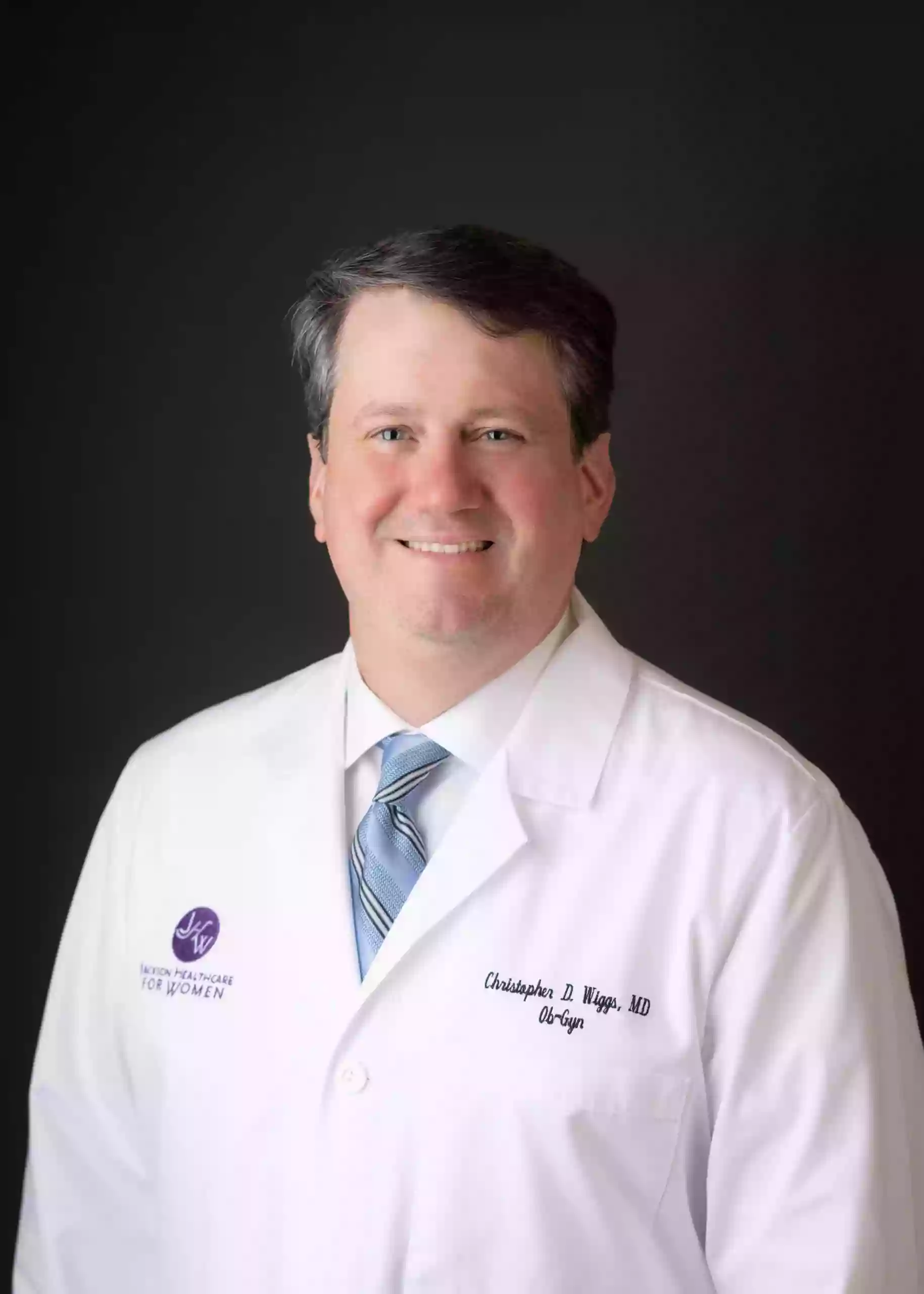 Dr. Christopher D. Wiggs, MD Dr. Christopher D. Wiggs, MD